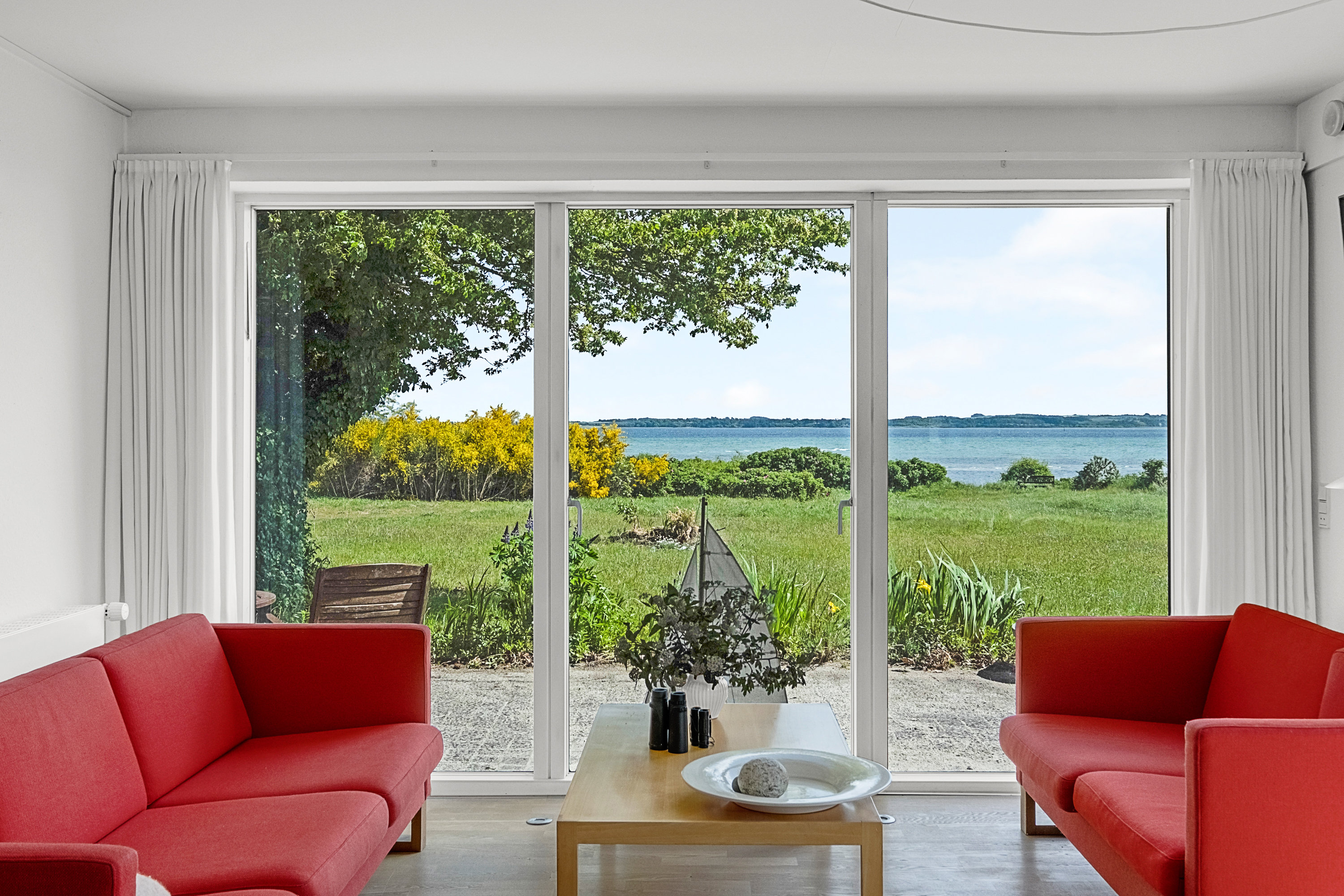 Fremhævet stue billede i fuldskærmstilstand. Billede af Strandvangsvej 116, 8250 Egå