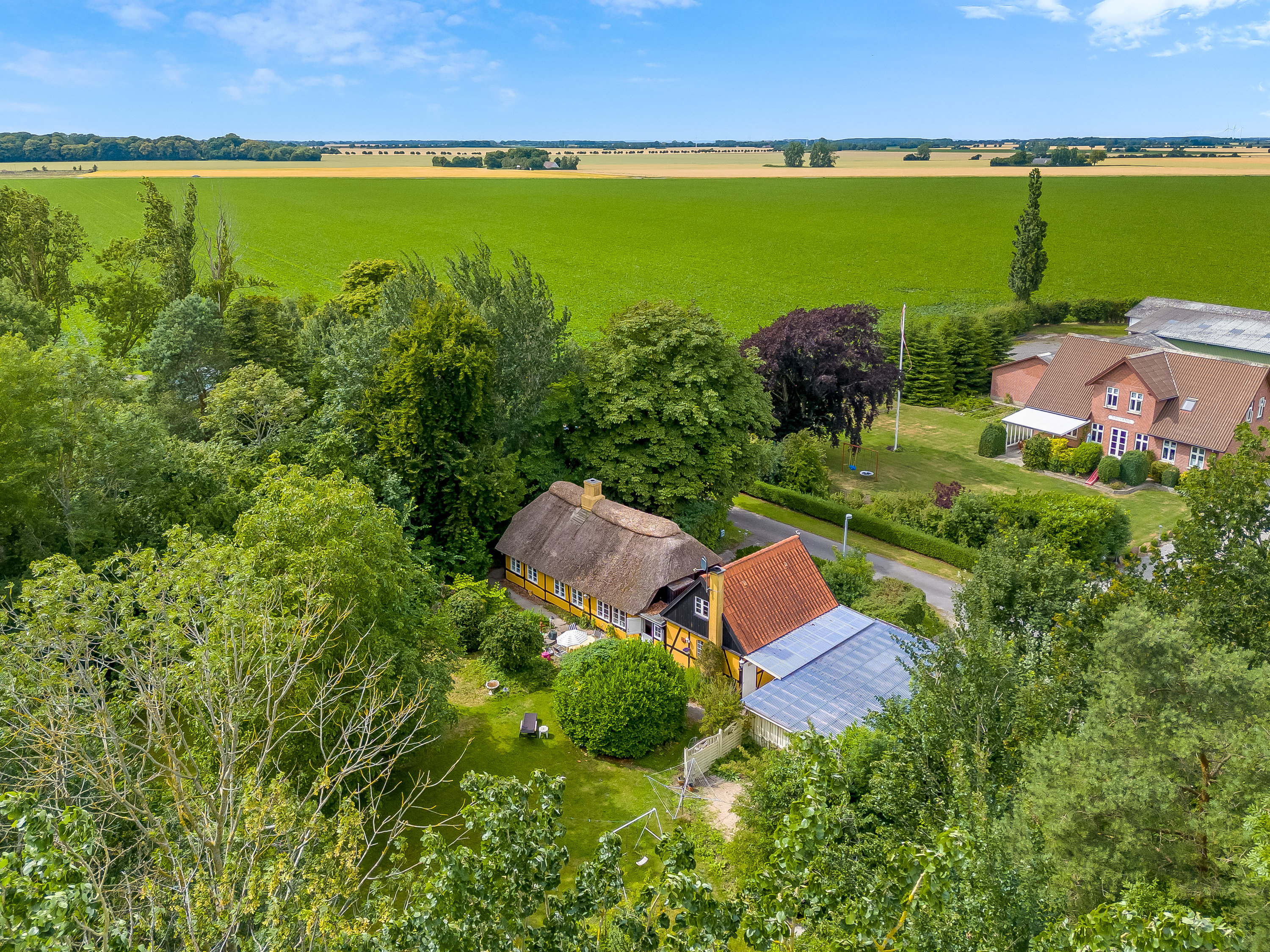 Fremhævet luftfoto billede i fuldskærmstilstand. Billede af Klønge Byvej 10, 4983 Dannemare