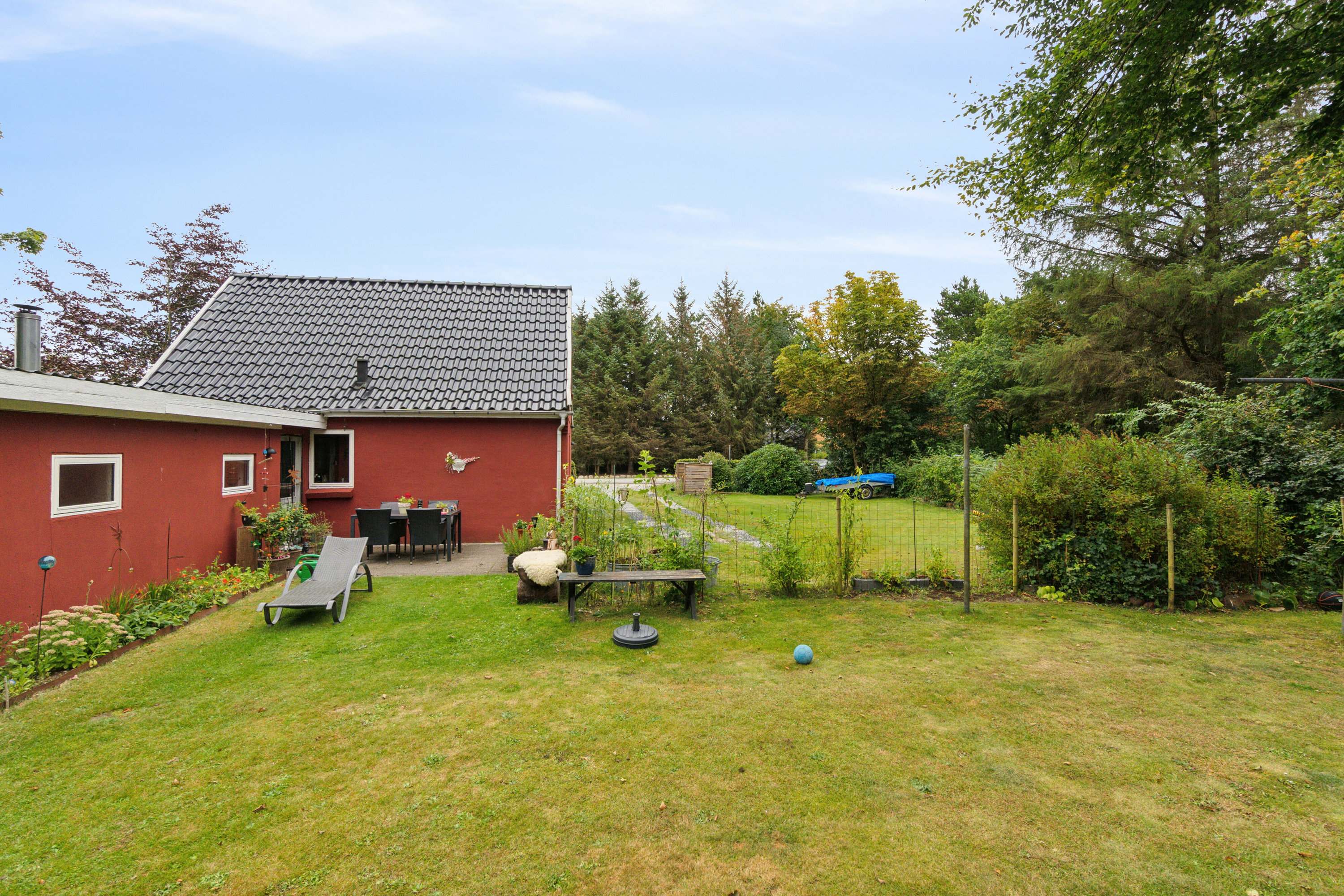 Fremhævet set fra haven billede i fuldskærmstilstand. Billede af Nørbyvej 1, Tved, 7700 Thisted