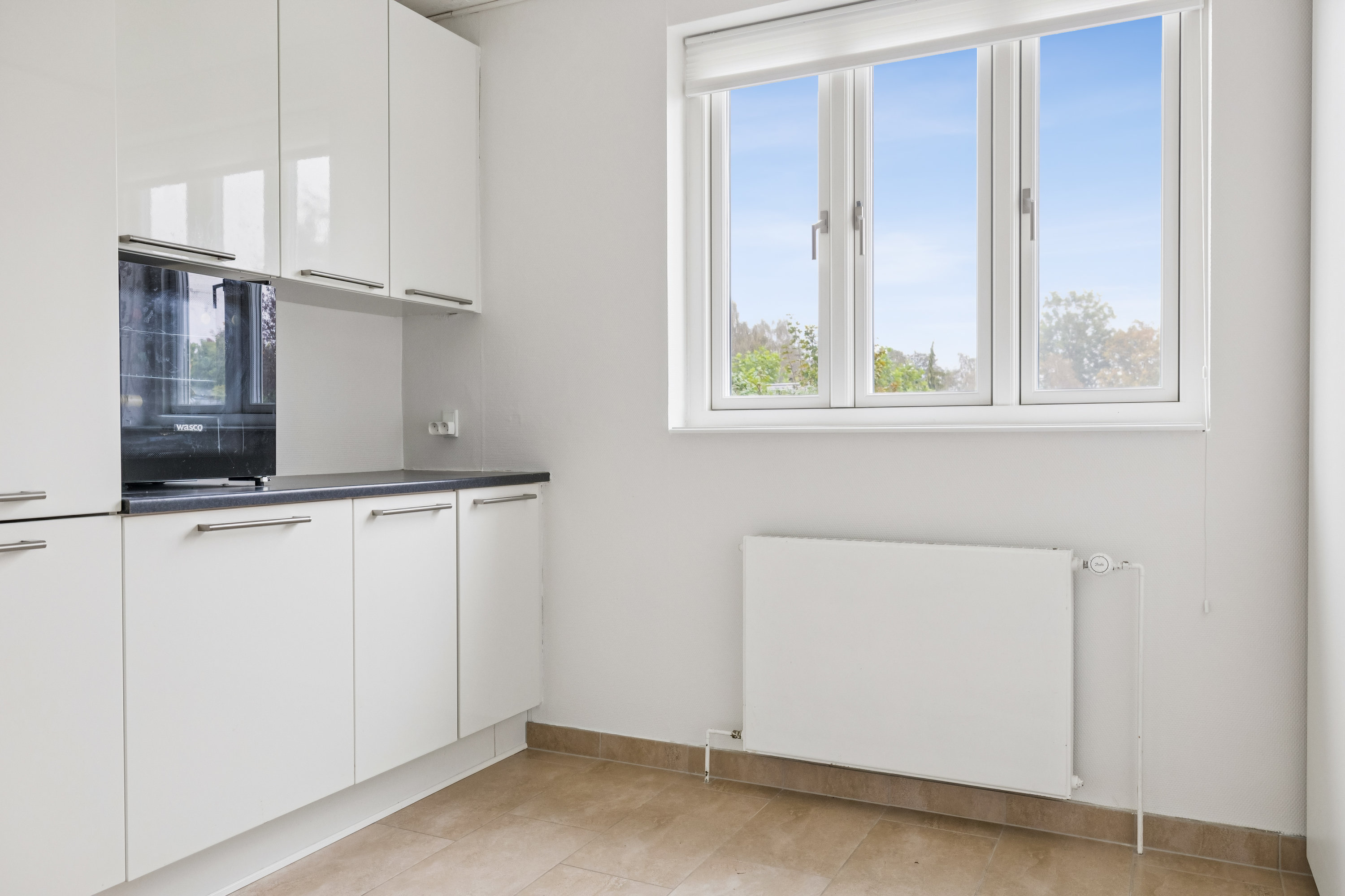 Fremhævet køkken billede i fuldskærmstilstand. Billede af Løvsangervænget 9, Snestrup, 5210 Odense NV