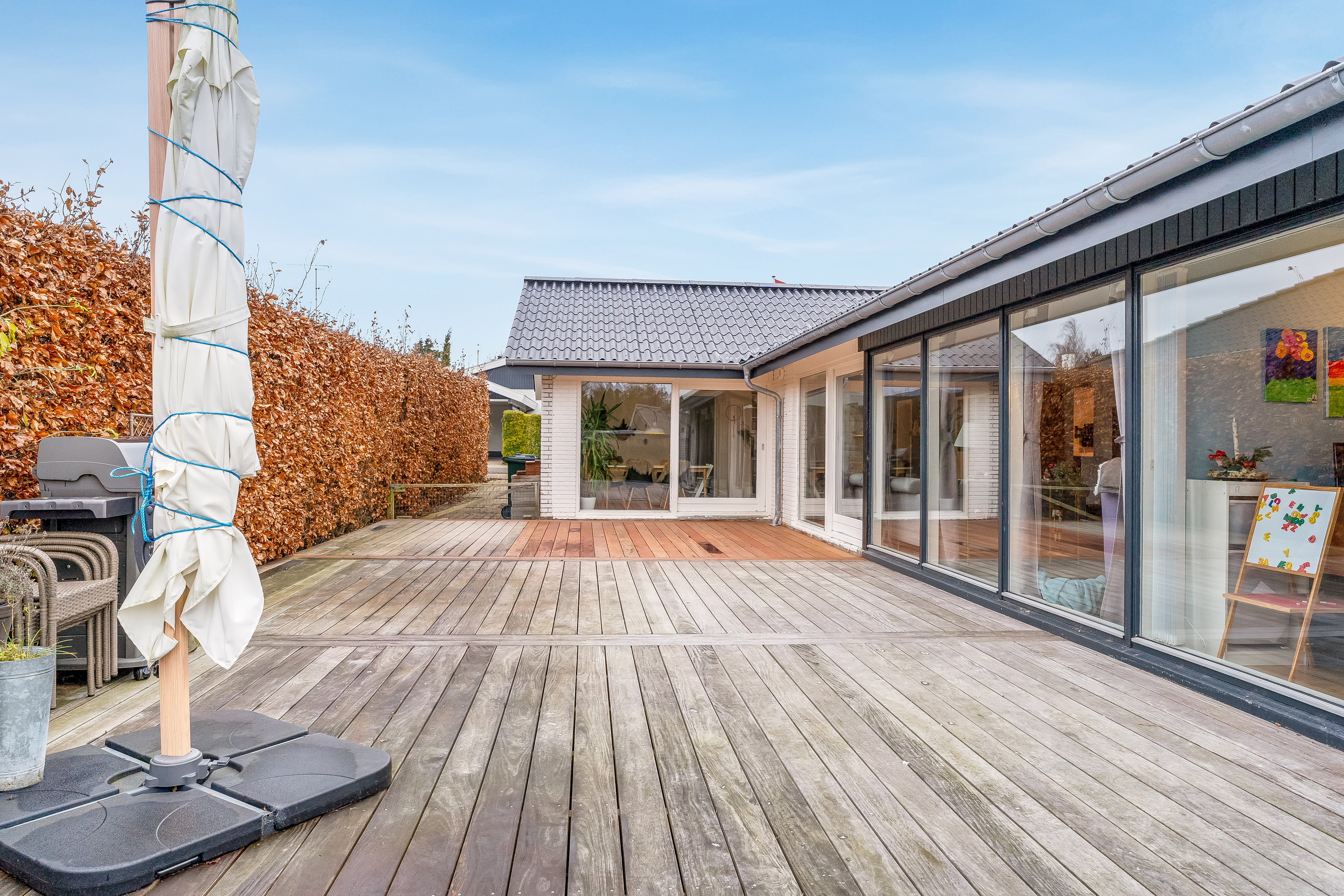 Fremhævet terrasse billede i fuldskærmstilstand. Billede af Sundvænget 3A, Hasselø Pl, 4800 Nykøbing F