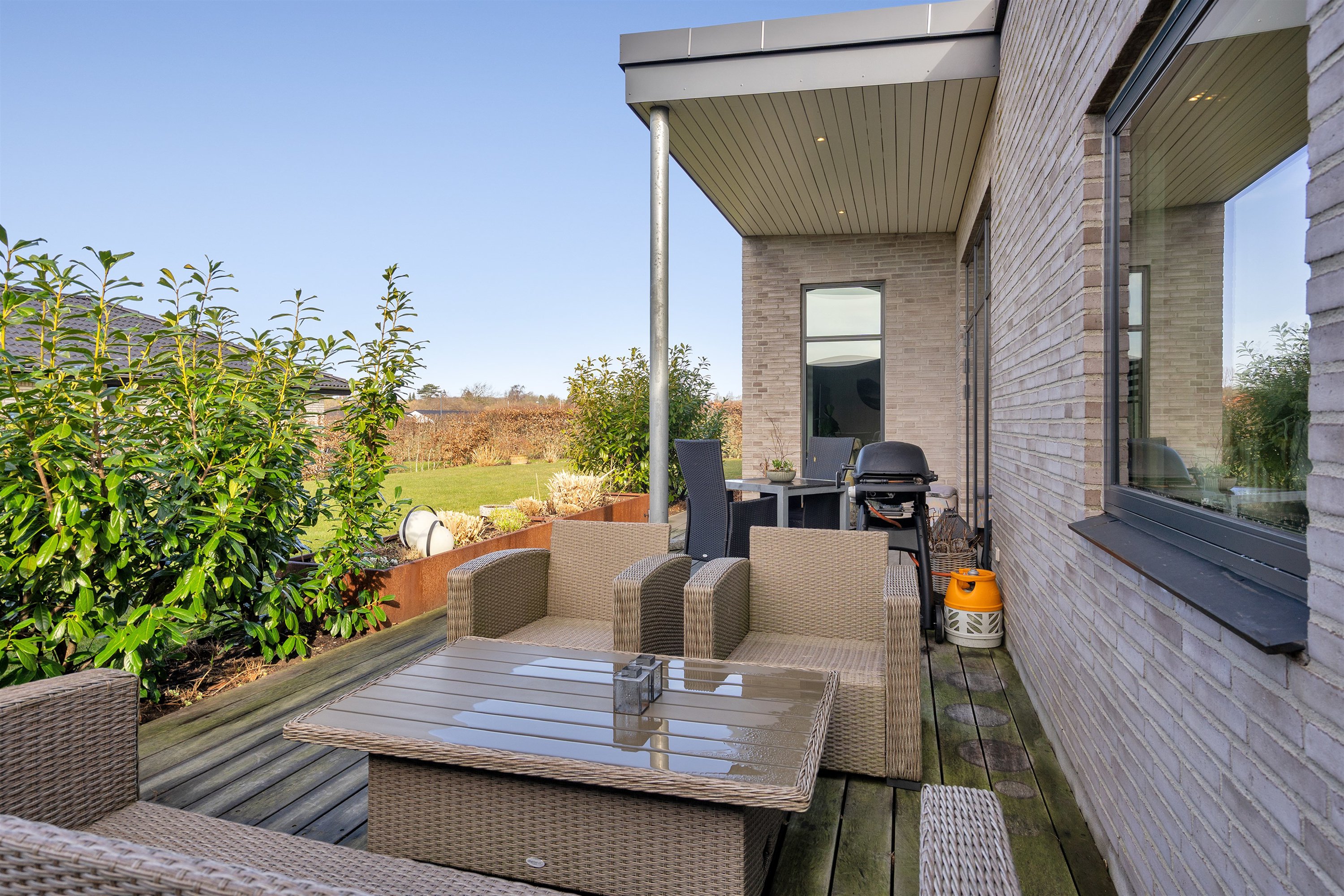 Fremhævet terrasse billede i fuldskærmstilstand. Billede af Søholm Parkvej 45, Glamsbjerg, 5620 Glamsbjerg