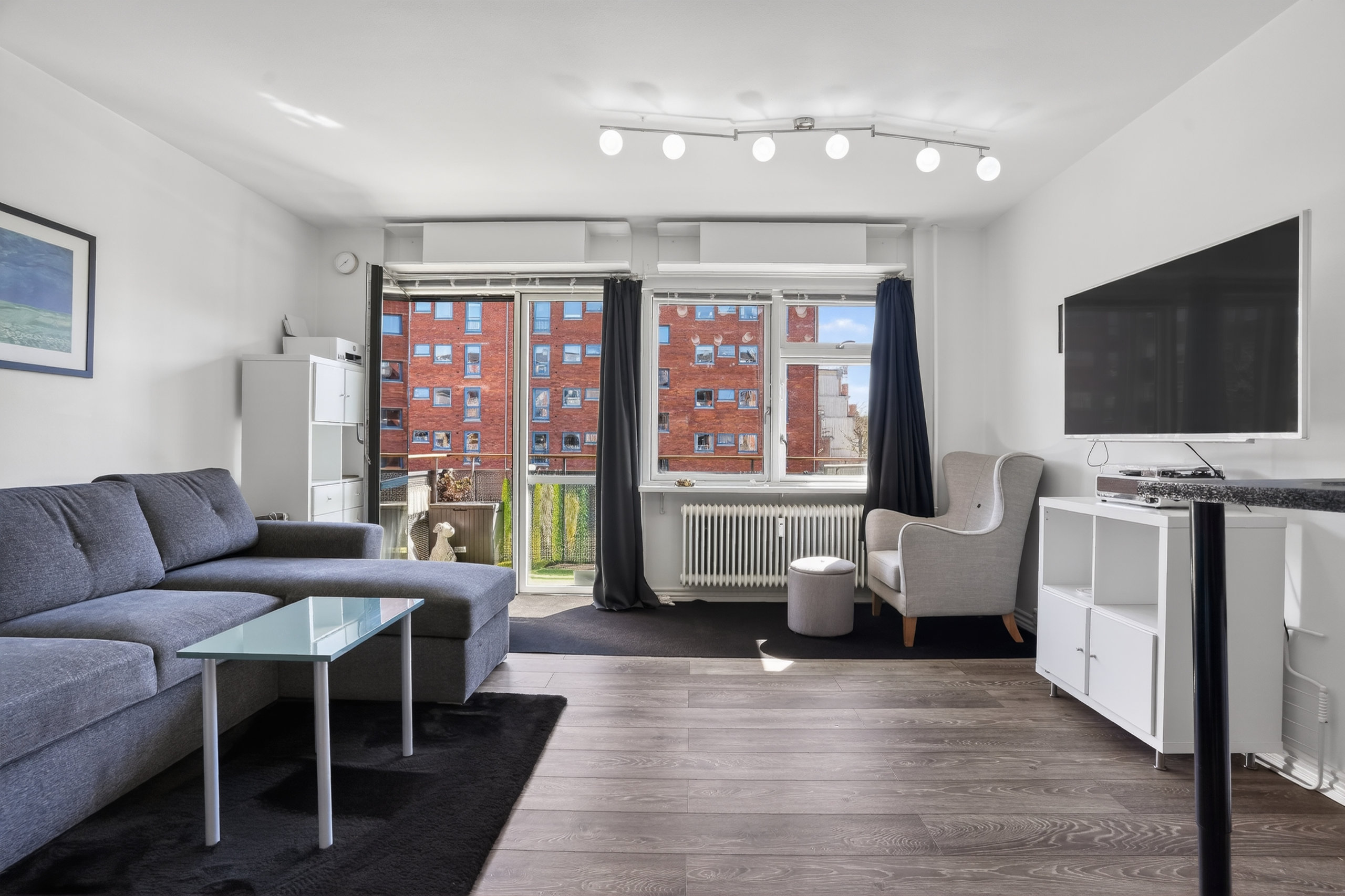 Fremhævet stue billede i fuldskærmstilstand. Billede af Lyshøjgårdsvej 89, 1. mf., 2500 Valby