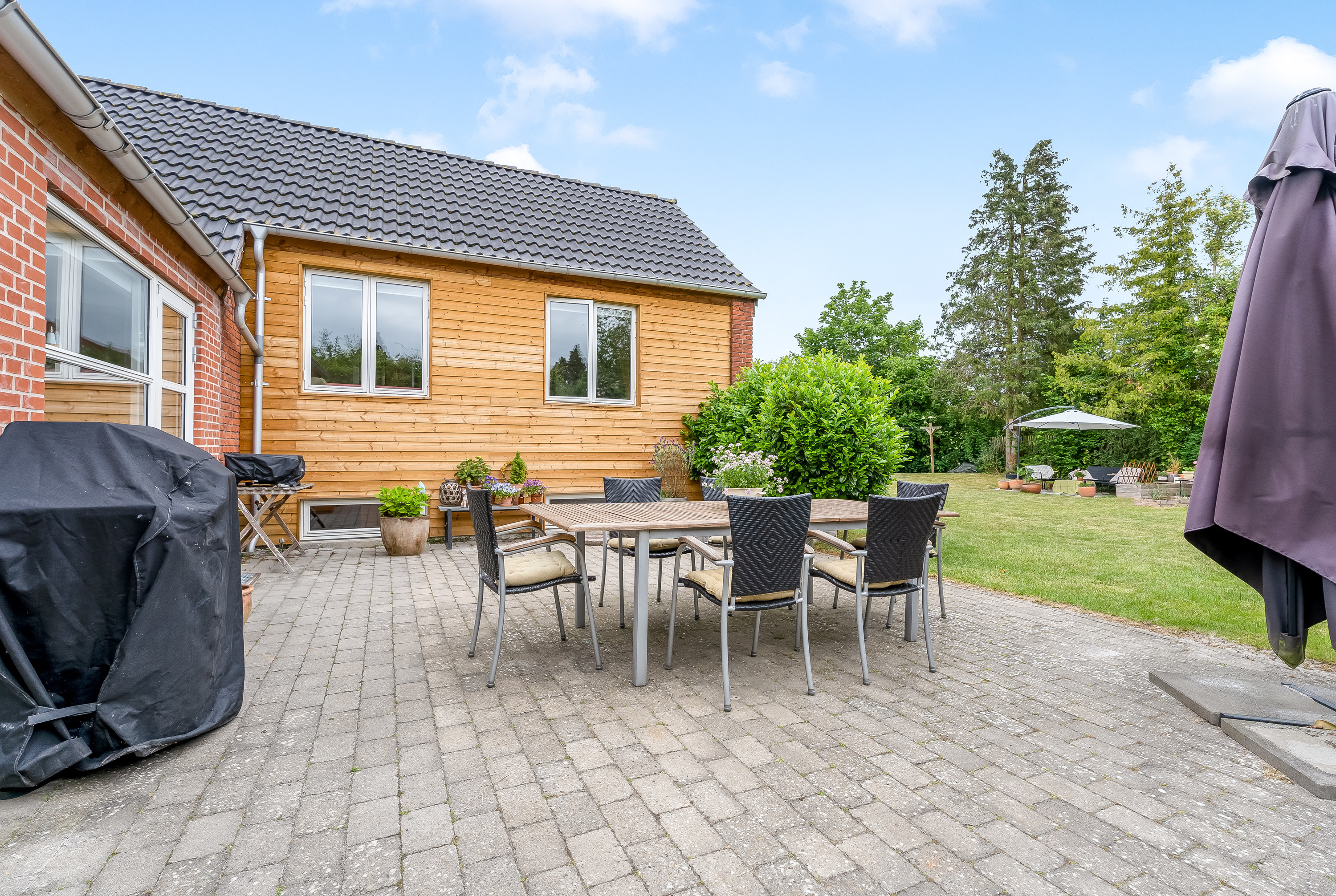 Fremhævet terrasse billede i fuldskærmstilstand. Billede af Vennerslundvej 2, 4800 Nykøbing F